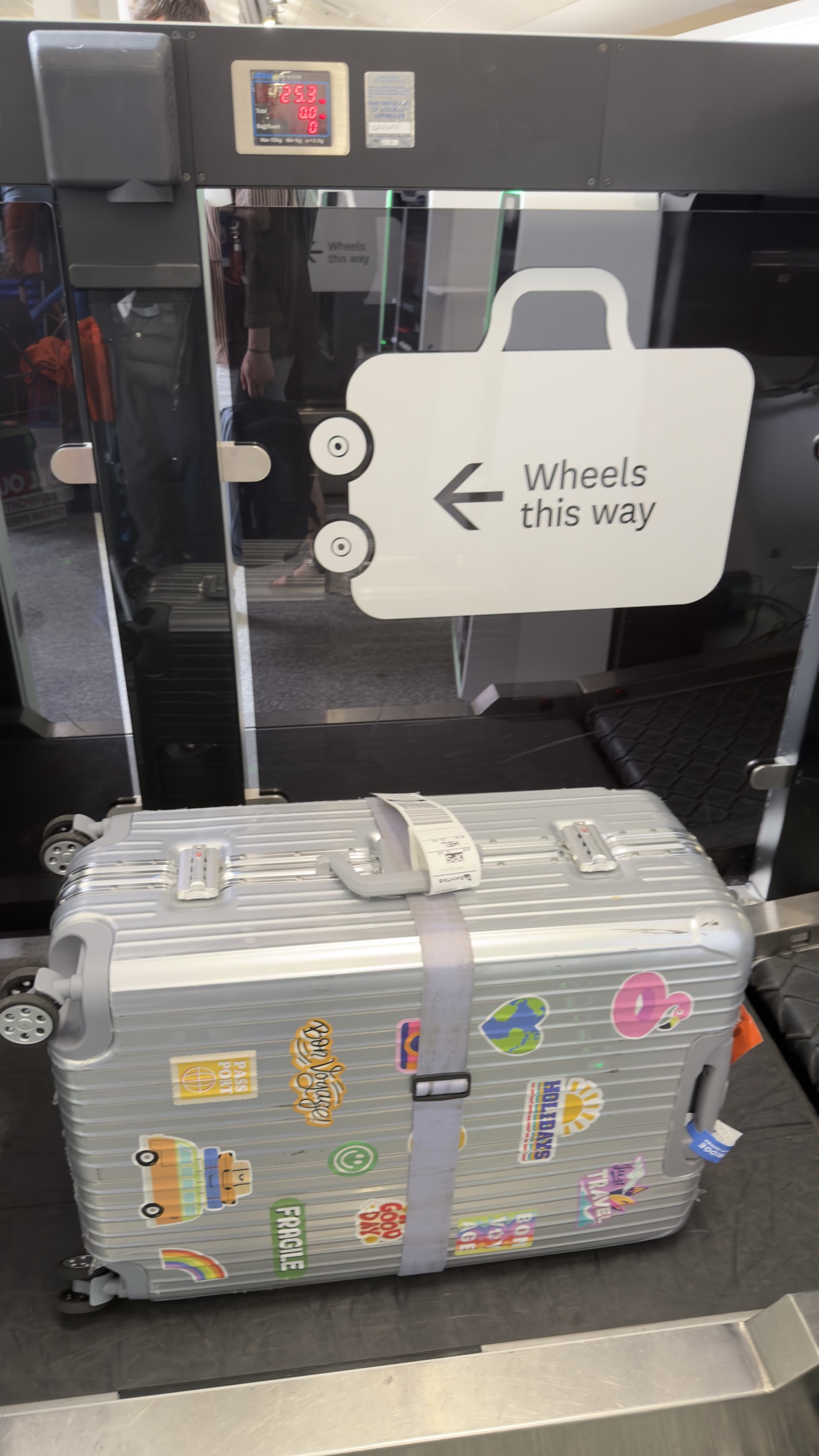 Suitcase on airport weighing scale
